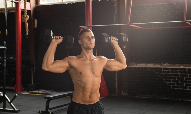 Bodybuilder doing shoulder press