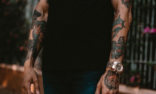 Man with tattooted arms